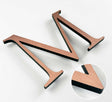 Light alt oxidized solid copper division 10 architectural sign letter with finish closeup