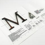 Alt oxidized solid copper division 10 architectural sign letter on mounting template with hardware