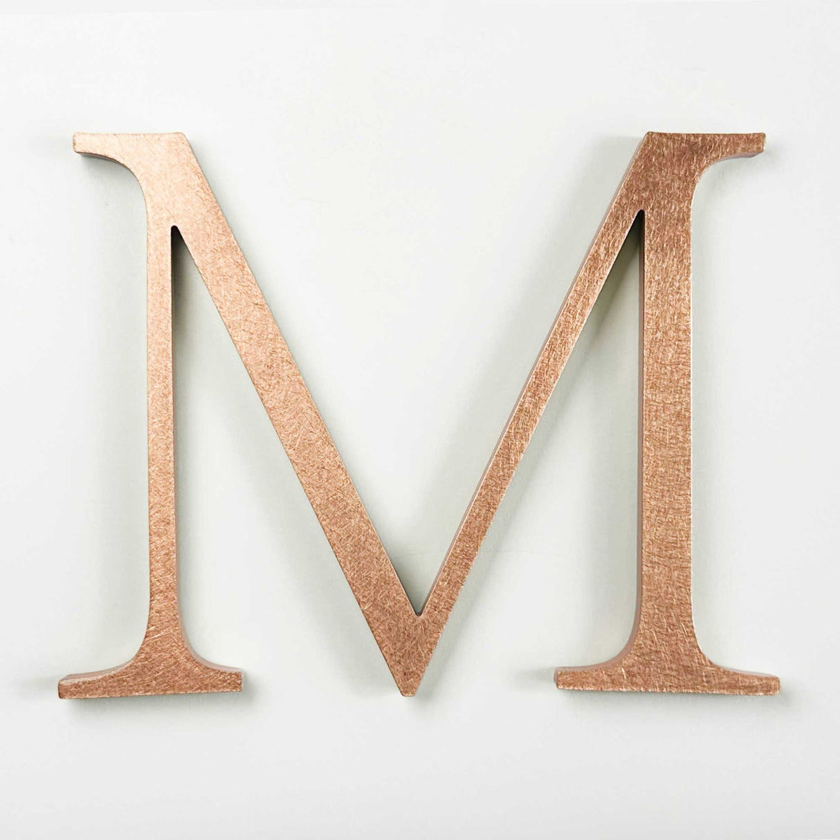 Orbitally brushed solid copper division 10 architectural sign letter