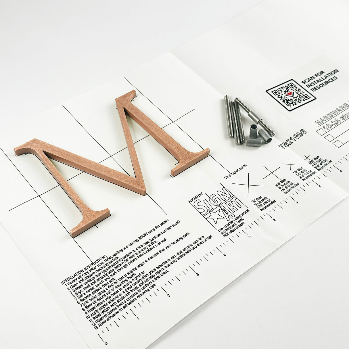 Orbitally brushed solid copper division 10 architectural sign letter on mounting template with hardware