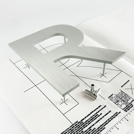Solid aluminum sign letter with hardware and mounting template