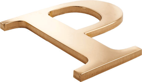 A bronze letter P with a polished face and brushed sides.