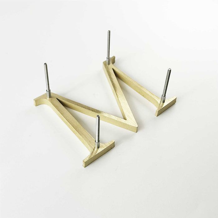 Solid brass division 10 architectural sign letter with back stud mounting and spacers