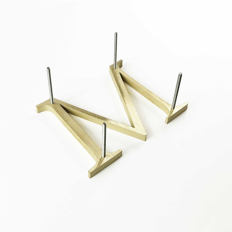 Solid brass division 10 architectural sign letter with back stud mounting and spacers