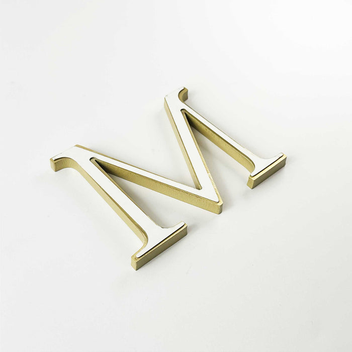 Solid brass division 10 architectural sign letter with double-sided tape mounting.