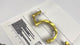 Random arch brushed solid brass division 10 architectural sign letters on a mounting template
