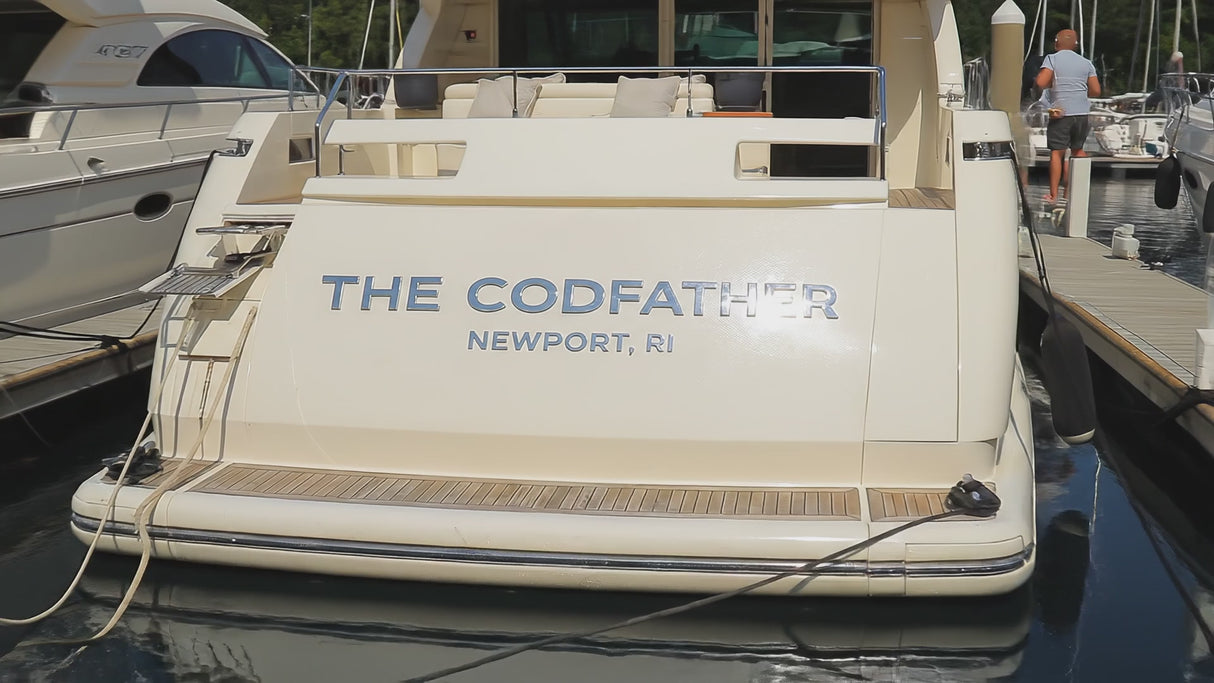 Pan of polished marine-grade stainless steel boat sign that reads The Codfather Newport, RI