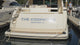 Pan of polished marine-grade stainless steel boat sign that reads The Codfather Newport, RI