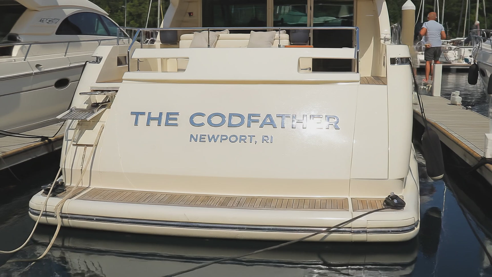 Pan of polished marine-grade stainless steel boat sign that reads The Codfather Newport, RI