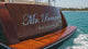 Pan of polished marine-grade stainless steel boat sign that reads Mr. Beaumont Fort Lauderdale, FL