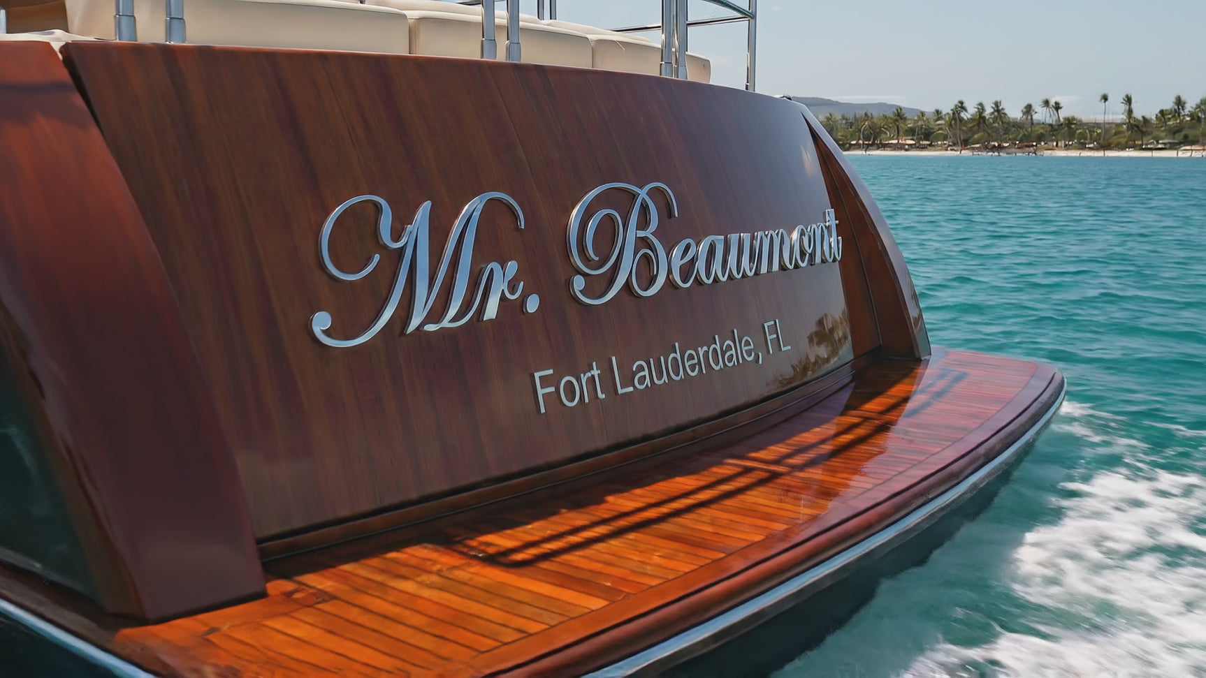 Pan of polished marine-grade stainless steel boat sign that reads Mr. Beaumont Fort Lauderdale, FL