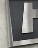 Brushed stainless steel sign on black background