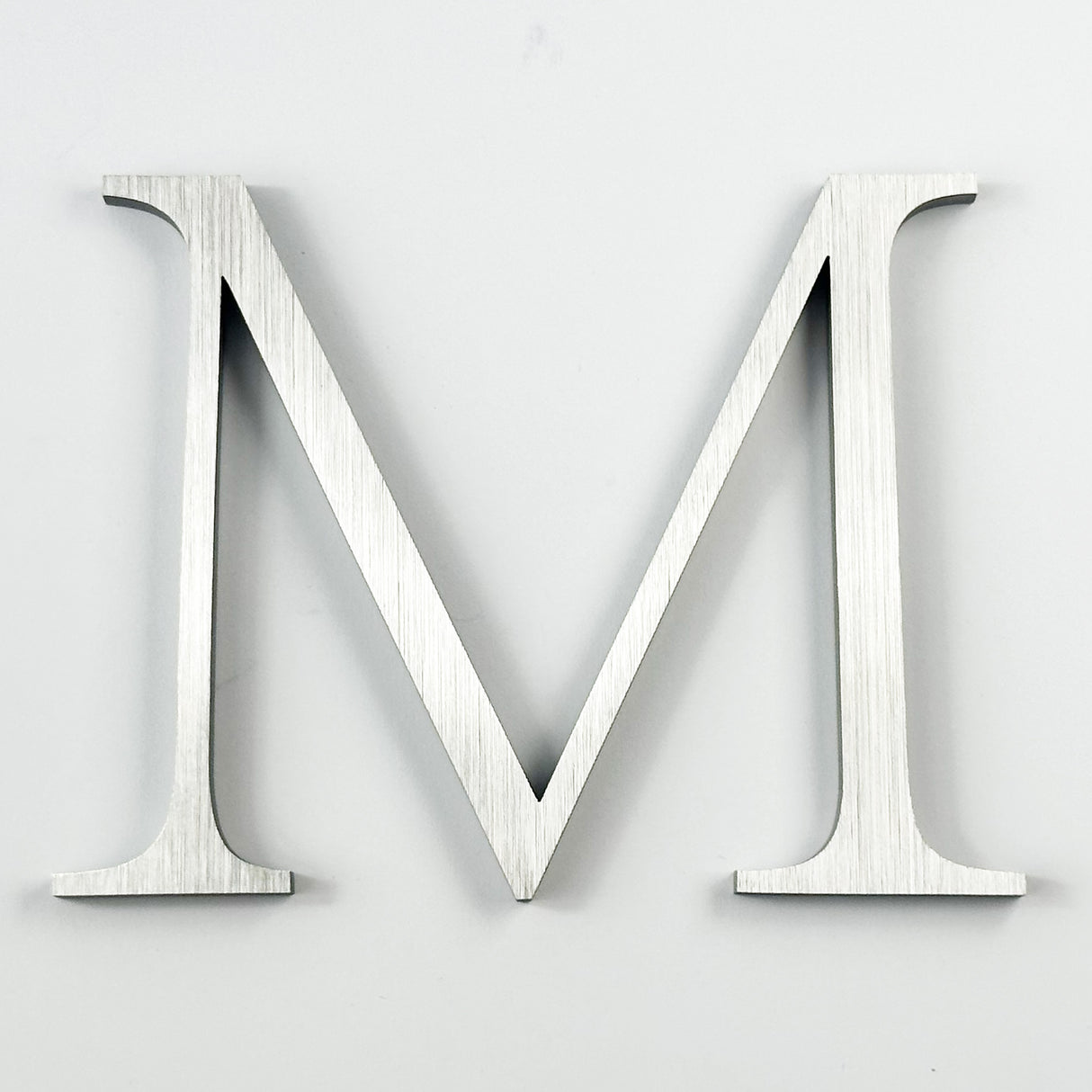 Vertically brushed solid 316 stainless steel division 10 architectural sign letter 