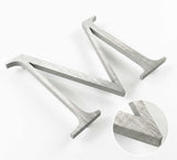 Vertically brushed 316 stainless steel division 10 architectural sign letter with finish closeup